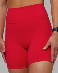 Woman wearing Fusion Ultra High-Rise 6" Short - Scarlet | Set:true | Angle:closeup | Model:Keisha | Size:S