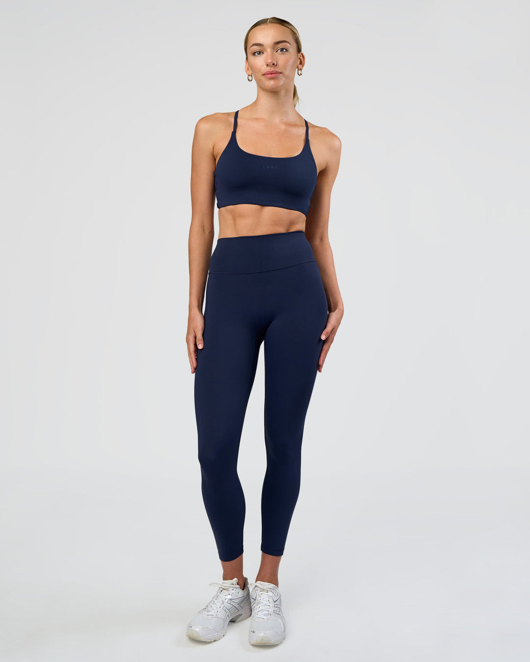Woman wearing Fusion Ultra High-Rise 7/8 Legging - Future Navy | Model:Evie | Size:S
