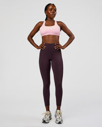 Woman wearing Fusion Ultra High-Rise 7/8 Legging - Midnight Plum | Model:Ellie | Size:S