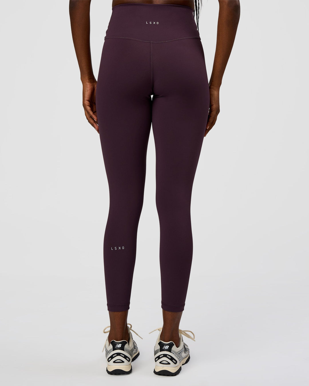 Woman wearing Fusion Ultra High-Rise 7/8 Legging - Midnight Plum | Model:Ellie | Size:S