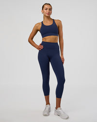 Woman wearing Fusion Ultra High-Rise 7/8 Legging Pockets - Future Navy | Model:Evie | Size:S