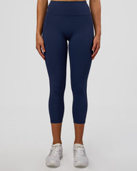 Woman wearing Fusion Ultra High-Rise 7/8 Legging Pockets - Future Navy | Model:Evie | Size:S