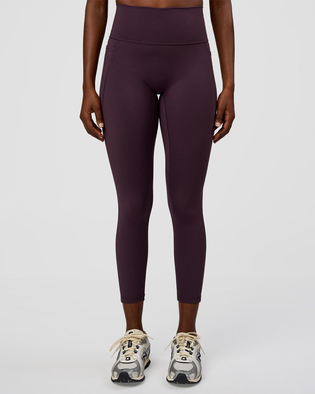 Woman wearing Fusion Ultra High-Rise 7/8 Legging Pockets - Midnight Plum | Model:Ellie | Size:S