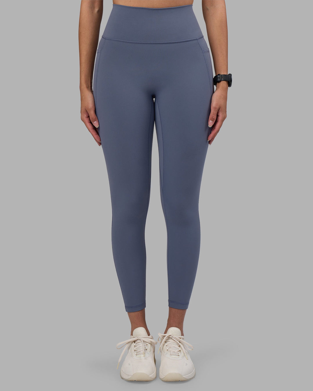 Woman wearing Fusion Ultra High-Rise 7/8 Legging Pockets - Night Shadow | Model:Rhiley | Size:S
