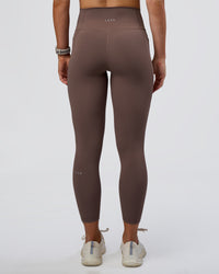 Woman wearing Fusion Ultra High-Rise 7/8 Legging Pockets - Peppercorn | Model:Emelia | Size:S