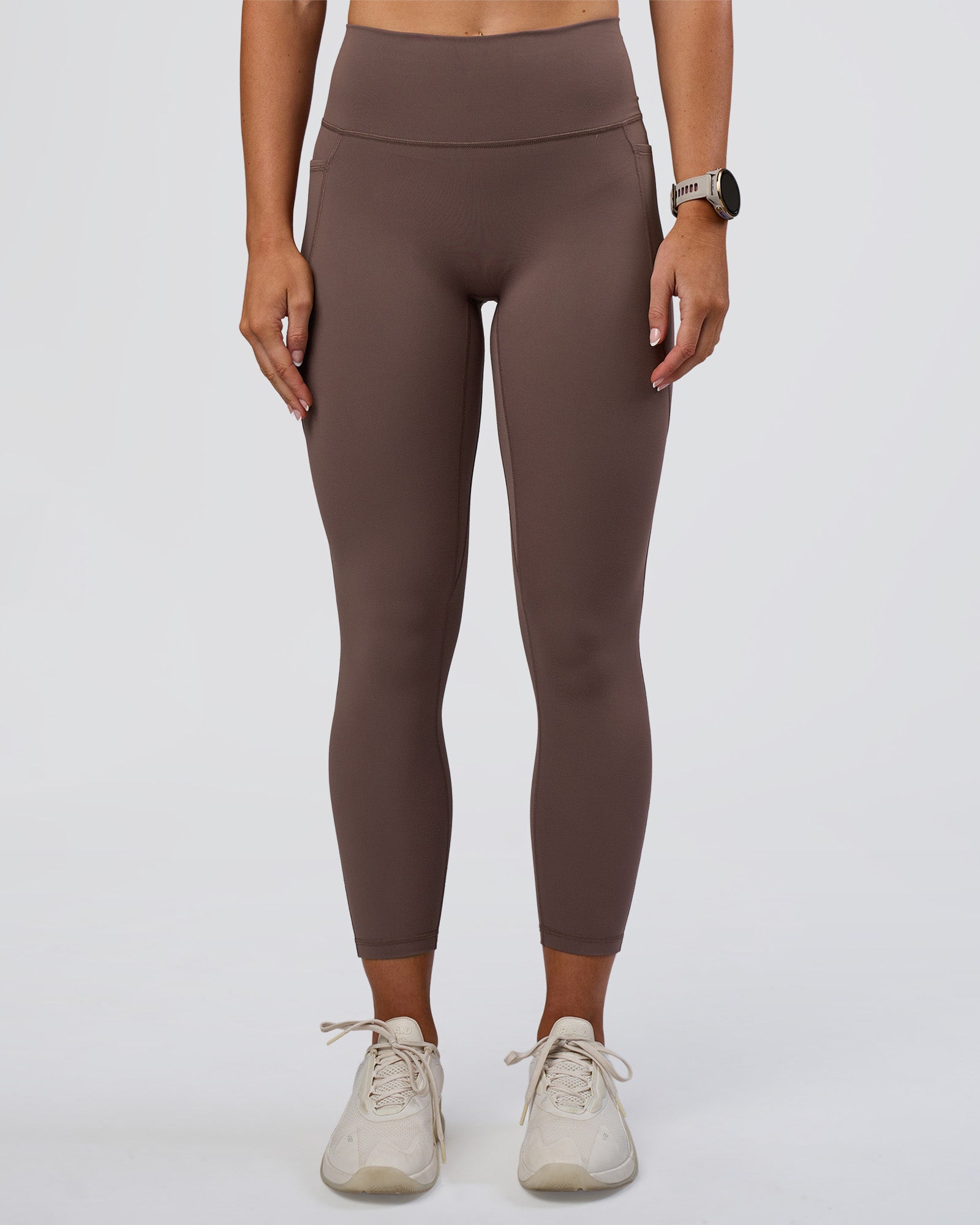 Woman wearing Fusion Ultra High-Rise 7/8 Legging Pockets - Peppercorn | Model:Emelia | Size:S