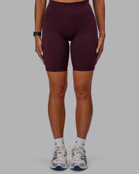 Woman wearing Fusion Ultra High-Rise 9" Short Pockets - Cherry Lacquer | Model:Vanessa | Size:S