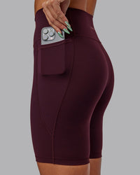 Woman wearing Fusion Ultra High-Rise 9" Short Pockets - Cherry Lacquer | Model:Vanessa | Size:S