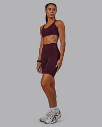 Woman wearing Fusion Ultra High-Rise 9" Short Pockets - Cherry Lacquer | Model:Vanessa | Size:S