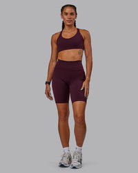 Woman wearing Fusion Ultra High-Rise 9" Short Pockets - Cherry Lacquer | Model:Vanessa | Size:S