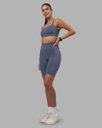 Woman wearing Fusion Ultra High-Rise 9" Short Pockets - Night Shadow | Model:Rhiley | Size:S