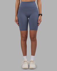 Woman wearing Fusion Ultra High-Rise 9" Short Pockets - Night Shadow | Model:Rhiley | Size:S
