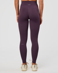 Woman wearing Fusion Ultra High-Rise Full Length Legging - Midnight Plum | Model:Emelia | Size:S