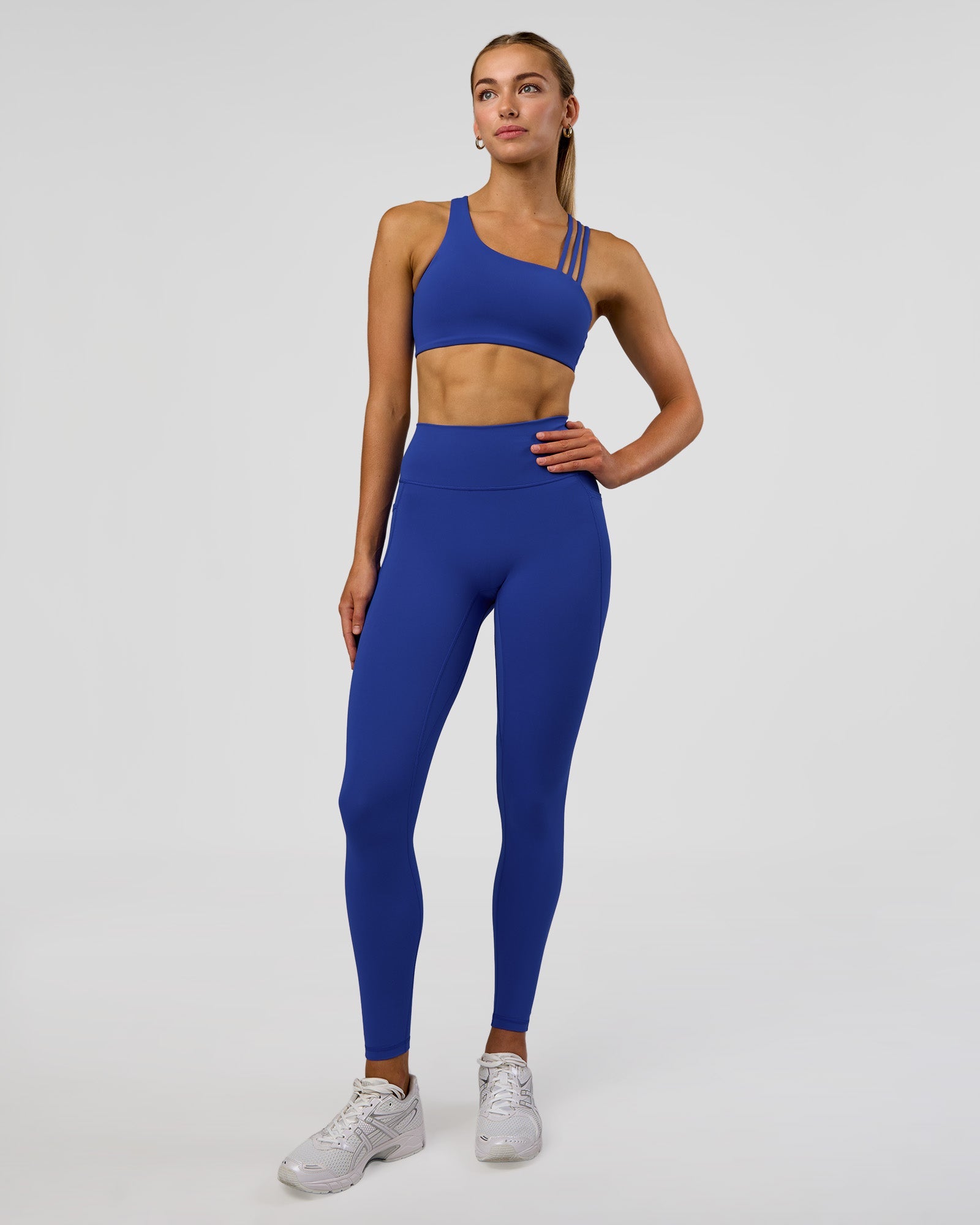 Woman wearing Fusion Ultra High-Rise Full Length Legging Pockets - Electric Indigo | Model:Evie | Size:S