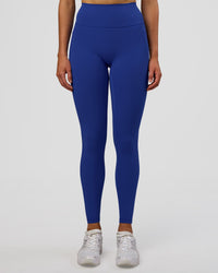 Woman wearing Fusion Ultra High-Rise Full Length Legging Pockets - Electric Indigo | Model:Evie | Size:S