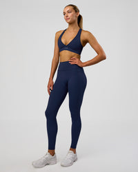 Woman wearing Fusion Ultra High-Rise Full Length Legging Pockets - Future Navy | Model:Evie | Size:S