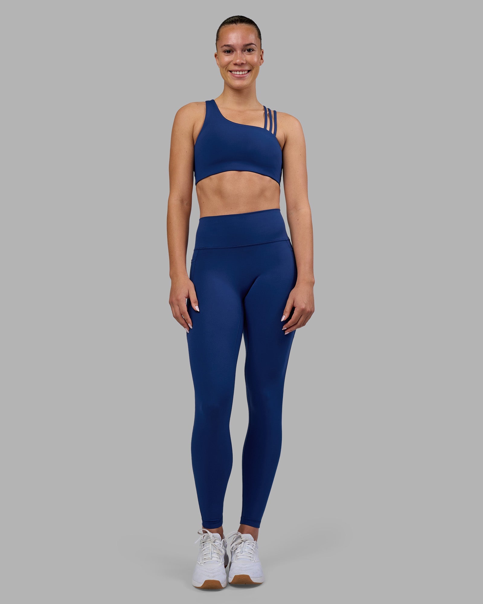 Woman wearing Fusion Ultra High-Rise Full Length Legging Pockets - Midnight Blue | Model:Charlize | Size:S