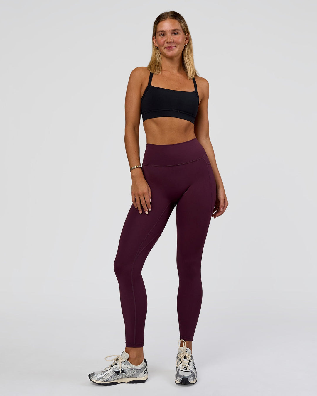Woman wearing Fusion Ultra High-Rise Full Length Legging Pockets - Midnight Plum | Model:Amity | Size:S