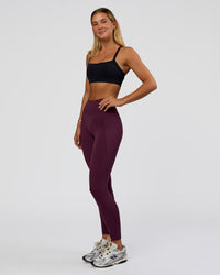 Woman wearing Fusion Ultra High-Rise Full Length Legging Pockets - Midnight Plum | Model:Amity | Size:S