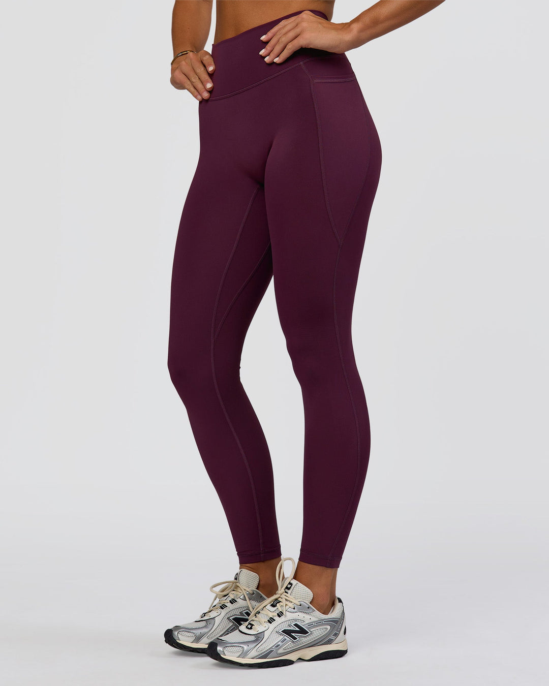 Woman wearing Fusion Ultra High-Rise Full Length Legging Pockets - Midnight Plum | Model:Amity | Size:S