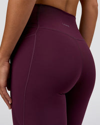 Woman wearing Fusion Ultra High-Rise Full Length Legging Pockets - Midnight Plum | Model:Amity | Size:S