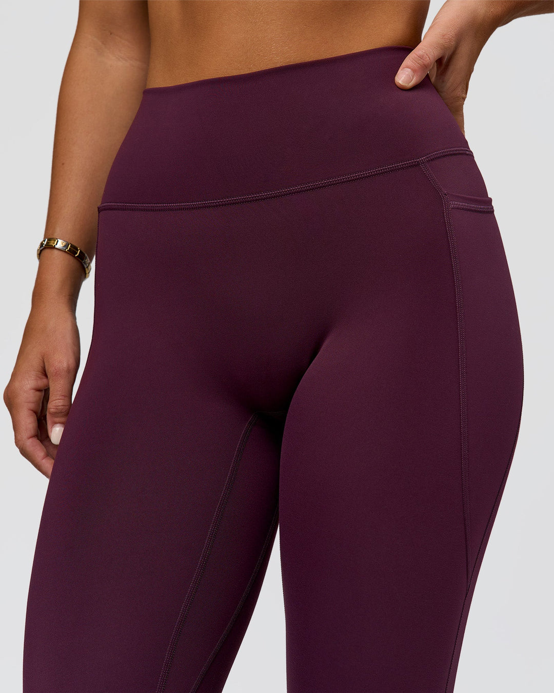 Woman wearing Fusion Ultra High-Rise Full Length Legging Pockets - Midnight Plum | Model:Amity | Size:S
