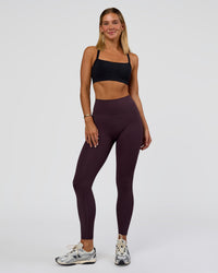 Woman wearing Fusion Ultra High-Rise Full Length Legging Pockets - Midnight Plum | Model:Amity | Size:S