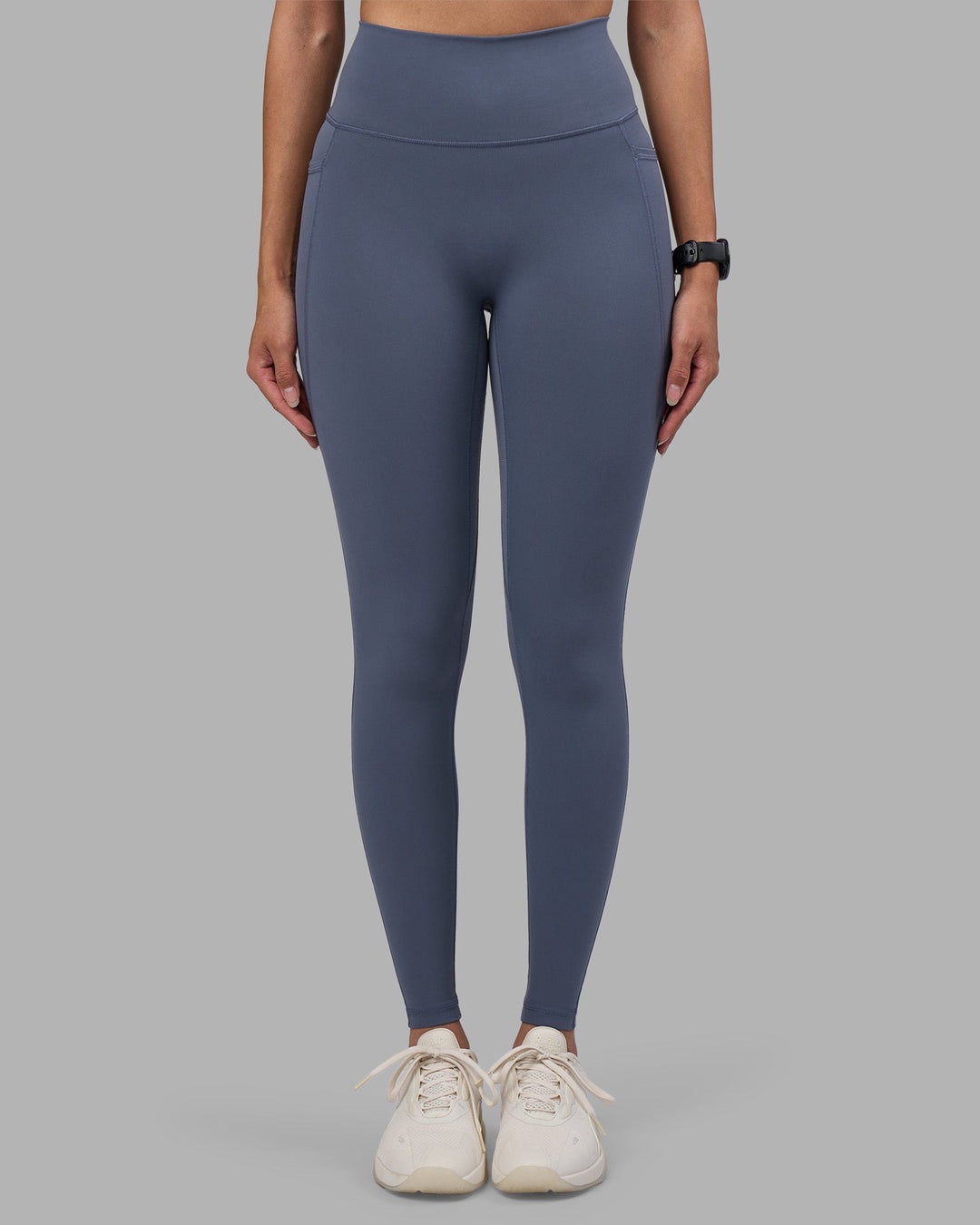 Woman wearing Fusion Ultra High-Rise Full Length Legging Pockets - Night Shadow | Model:Rhiley | Size:S