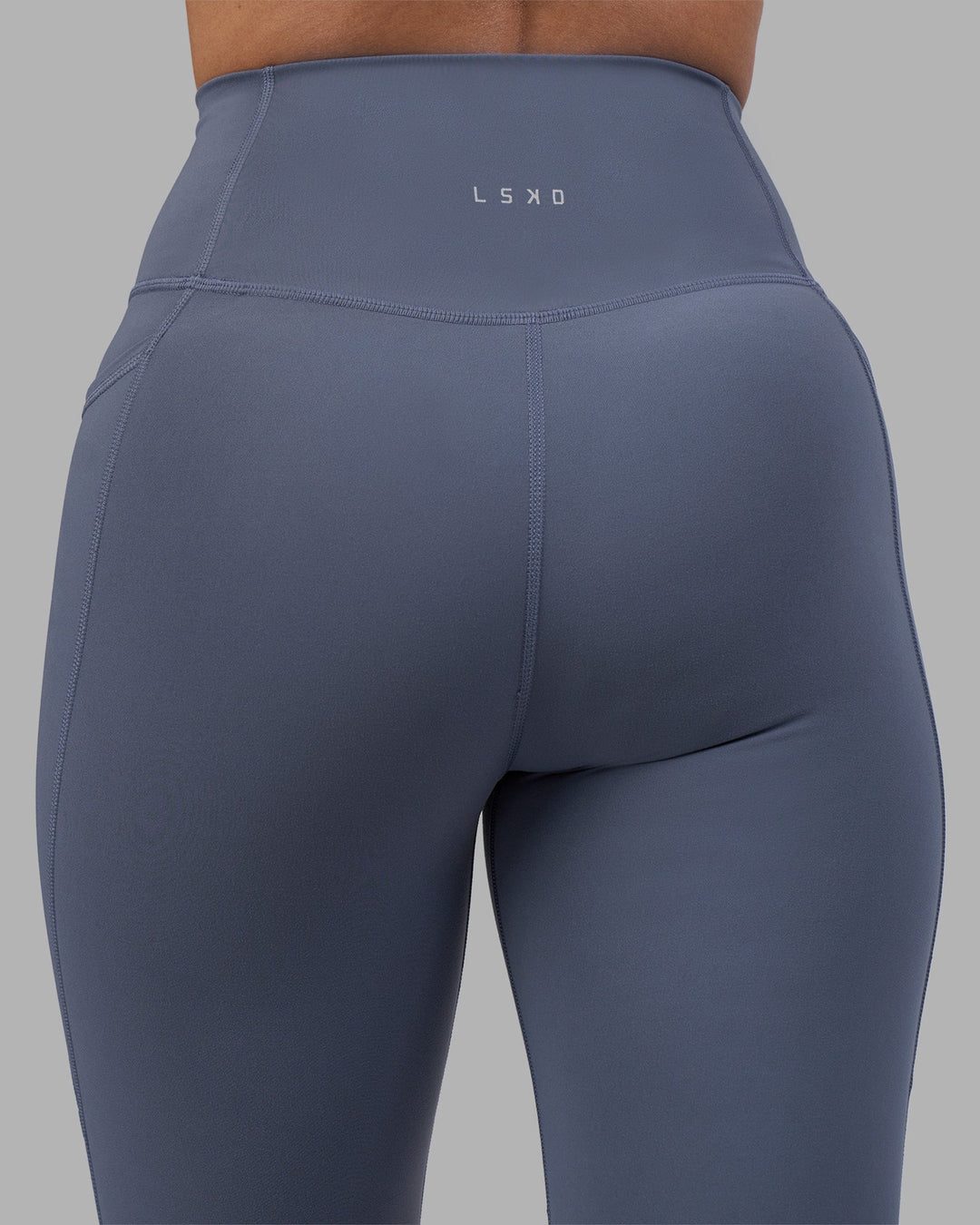 Woman wearing Fusion Ultra High-Rise Full Length Legging Pockets - Night Shadow | Model:Rhiley | Size:S