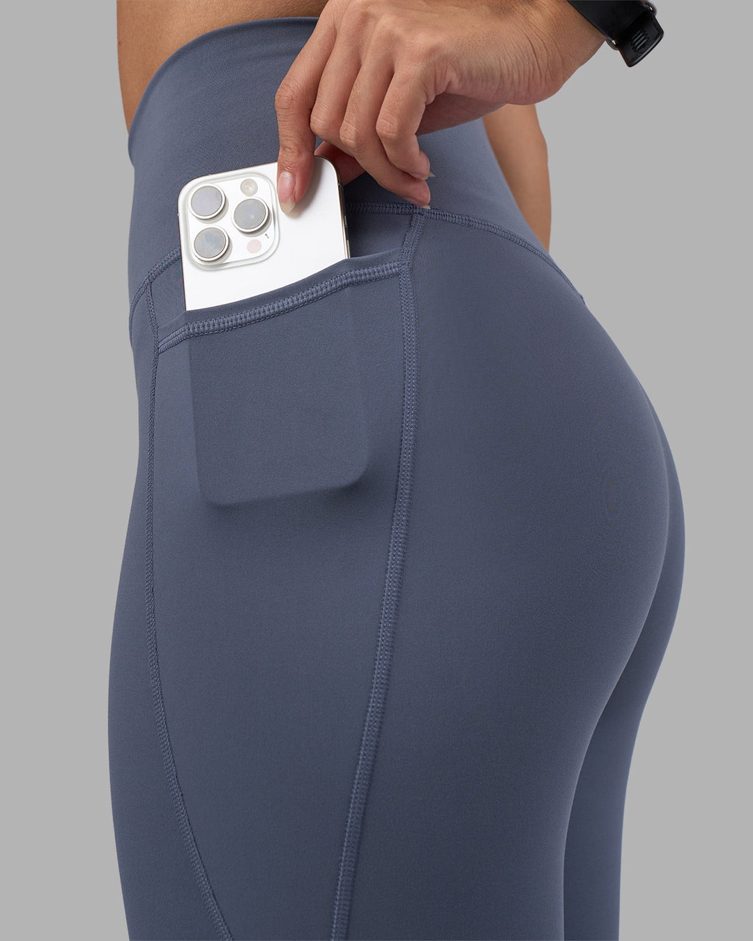 Woman wearing Fusion Ultra High-Rise Full Length Legging Pockets - Night Shadow | Model:Rhiley | Size:S