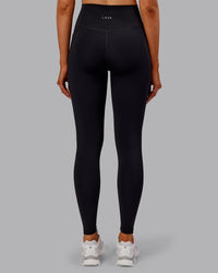 Woman wearing Fusion Ultra High-Rise Full Length Thermal Legging Pockets - Black | Model:Ella | Size:S