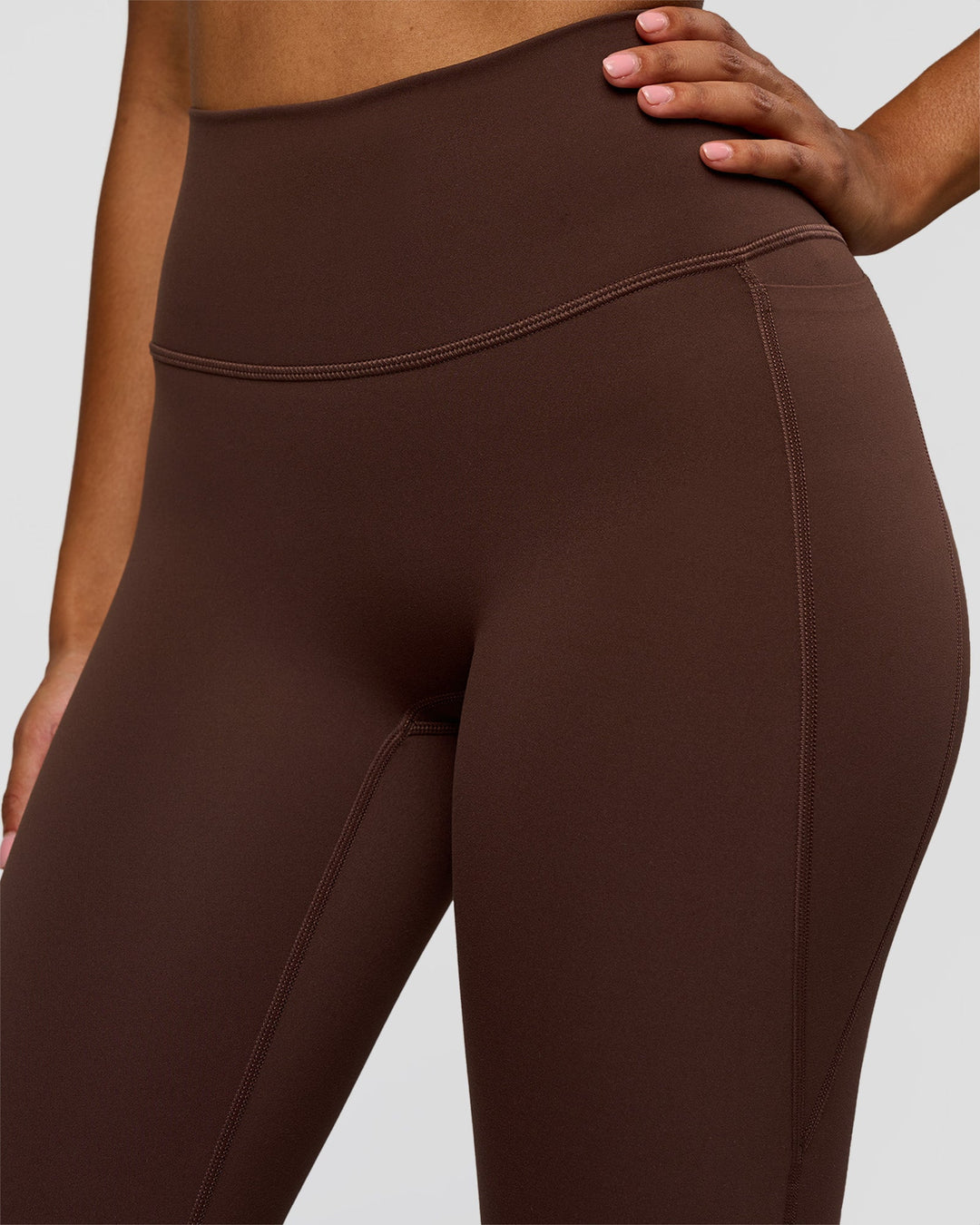 Woman wearing Woman wearing Fusion V-Contour High-Rise Flared Legging Pockets - Hot Chocolate | Model:Jordan | Size:S
