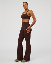 Woman wearing Fusion V-Contour High-Rise Flared Tall Legging Pockets - Hot Chocolate | Model:Rosie | Size:S