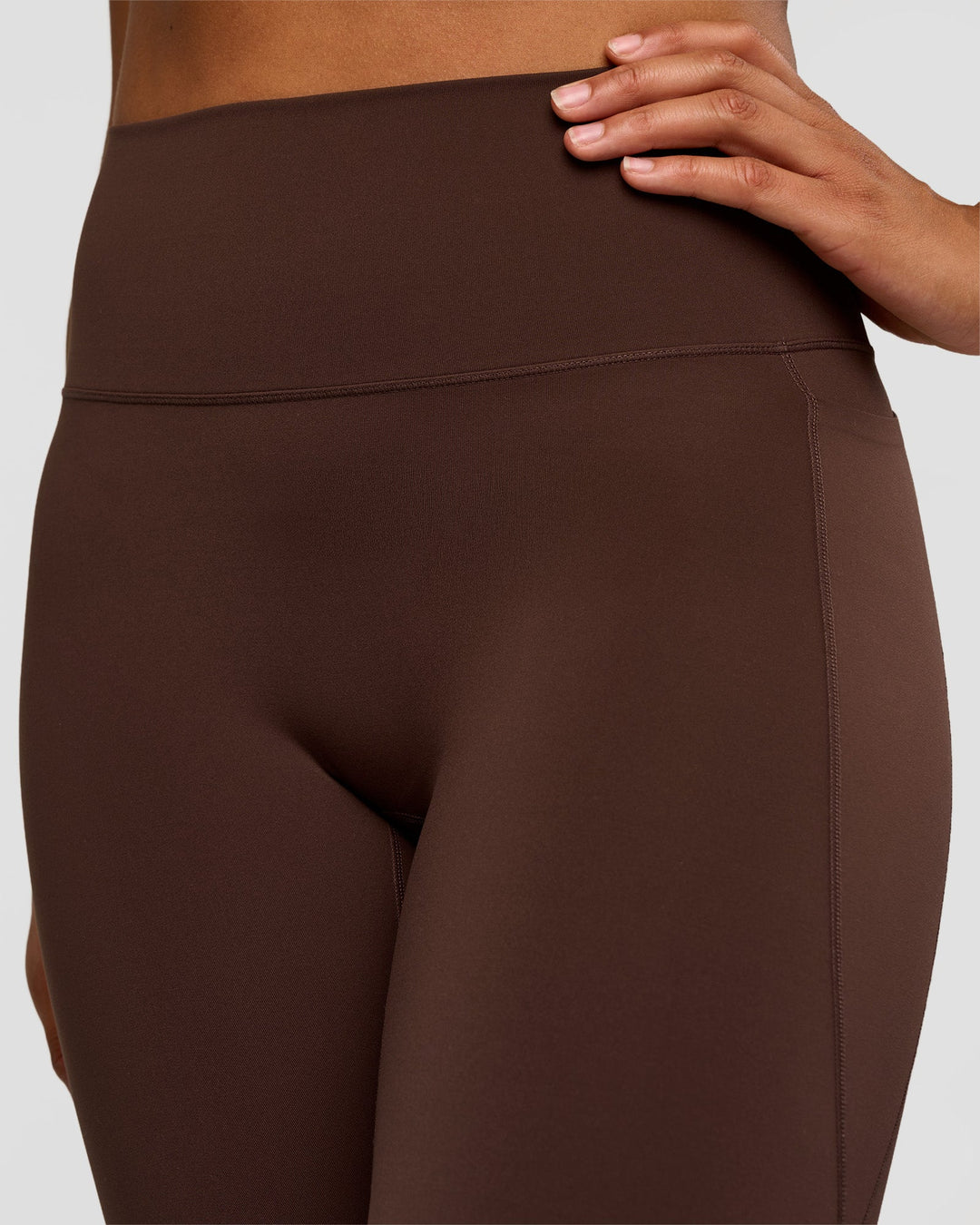 Woman wearing Fusion V-Contour High-Rise Flared Tall Legging Pockets - Hot Chocolate | Model:Rosie | Size:S