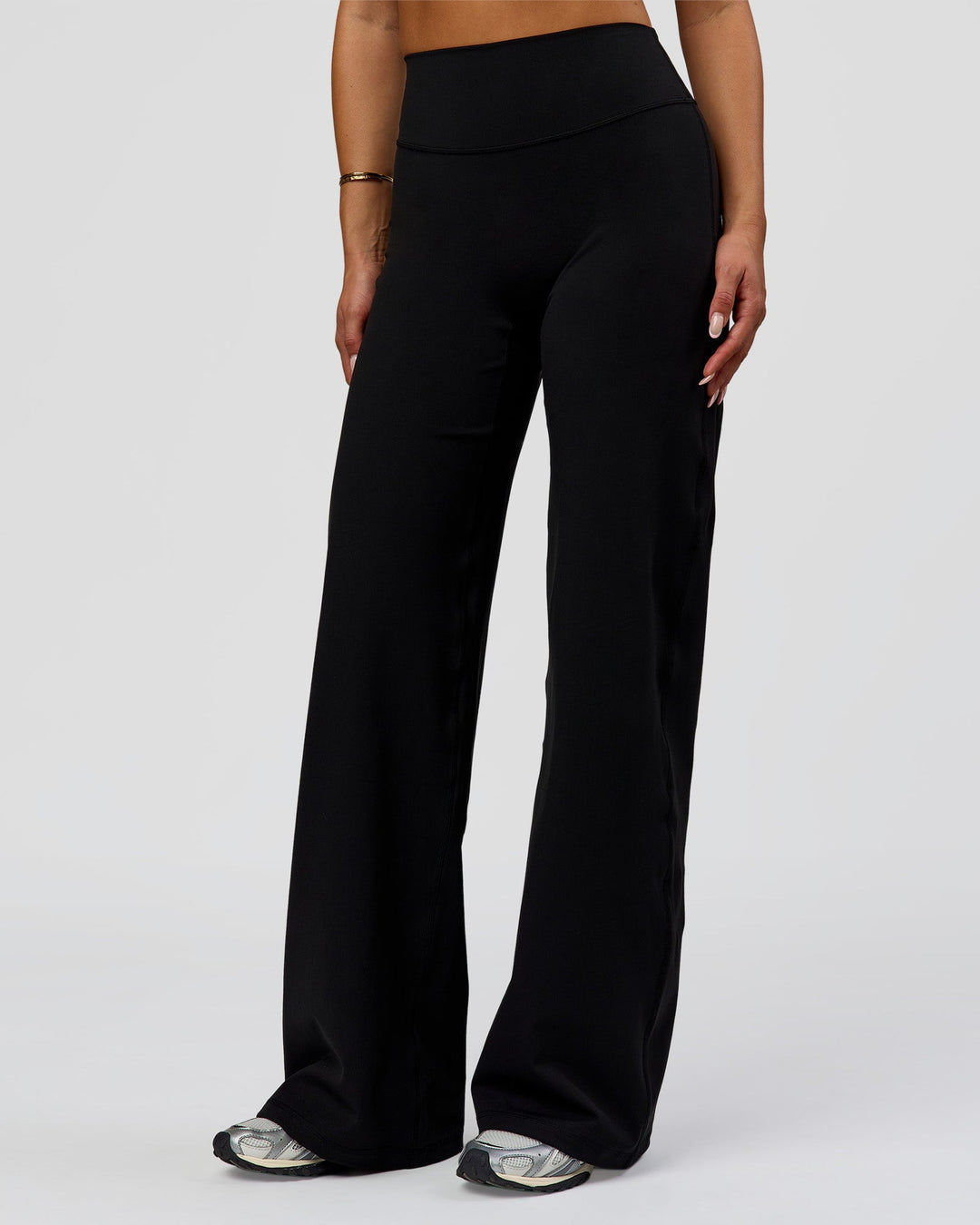 Woman wearing Fusion V-Contour High-Rise Pant - Black | Model:Bianca | Size:S