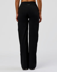 Woman wearing Fusion V-Contour High-Rise Pant - Black | Model:Bianca | Size:S