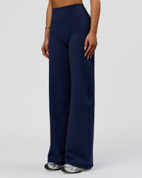 Woman wearing Fusion V-Contour High-Rise Pant - Future Navy | Model:Bianca | Size:S