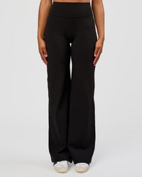 Woman wearing Fusion V-Contour High-Rise Tall Pant - Black | Model:Rosie | Size:S