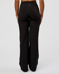 Woman wearing Fusion V-Contour High-Rise Tall Pant - Black | Model:Rosie | Size:S