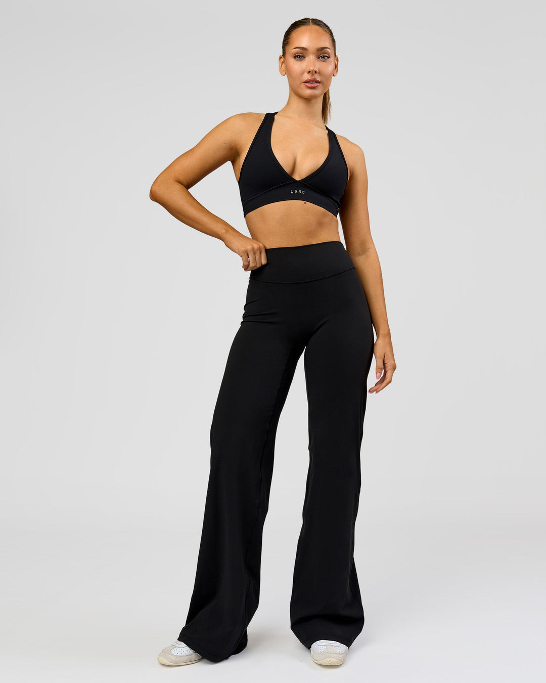 Woman wearing Fusion V-Contour High-Rise Tall Pant - Black | Model:Claire | Size:S