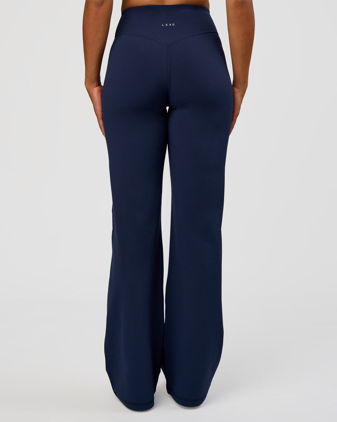 Woman wearing Fusion V-Contour High-Rise Tall Pant - Future Navy | Model:Rosie | Size:S
