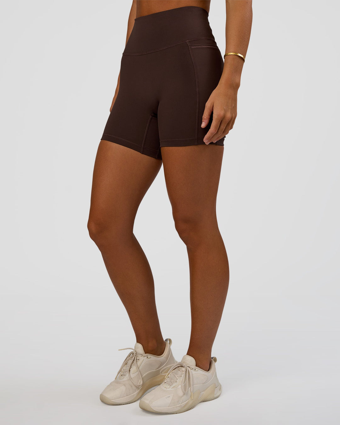 Woman wearing Fusion V-Contour Ultra High-Rise 6&quot; Short Pockets - Hot Chocolate | Model:Amity | Size:S