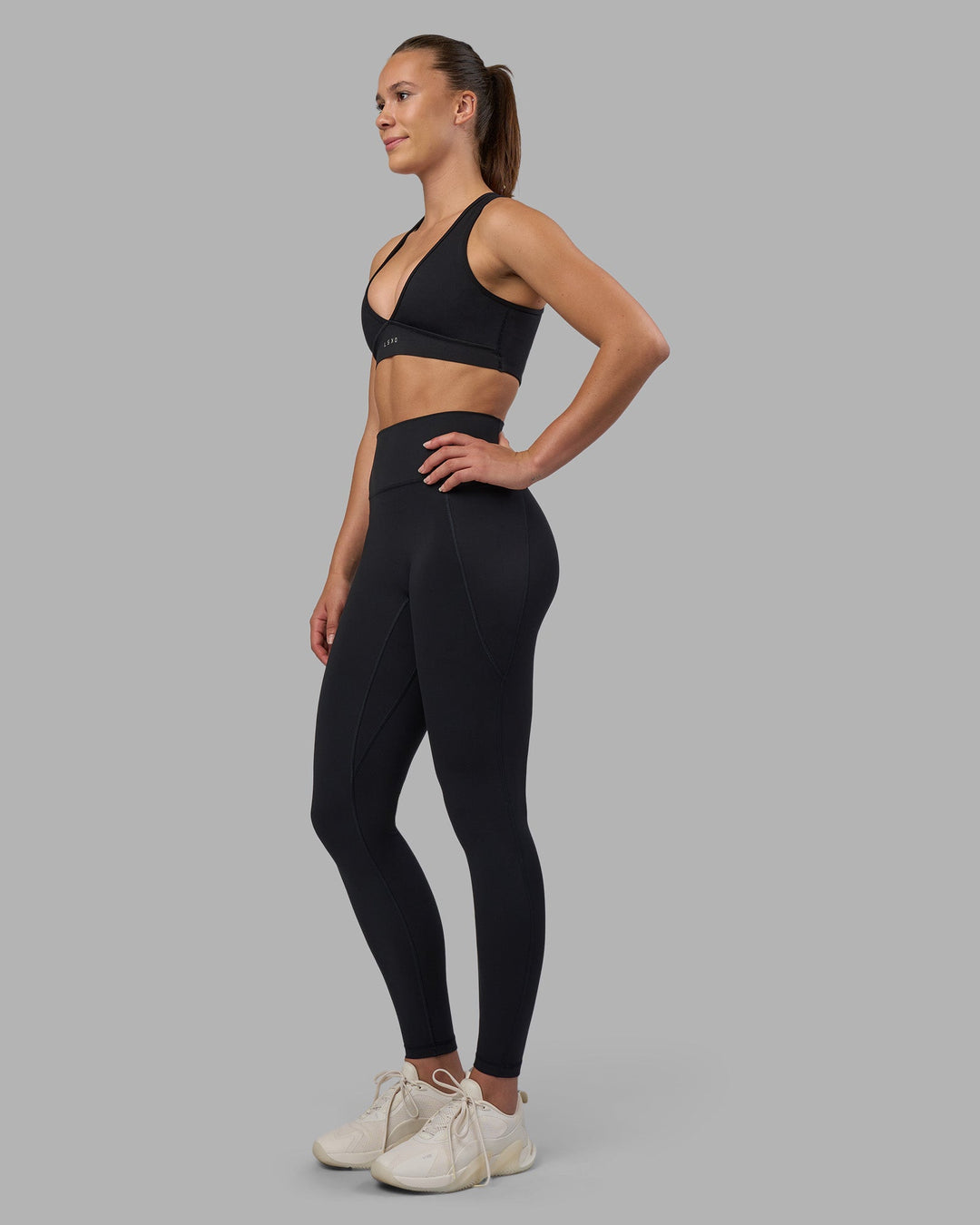 Woman wearing Fusion V-Contour Ultra High-Rise Full Length Legging Pockets - Black | Model:Charlize | Size:S