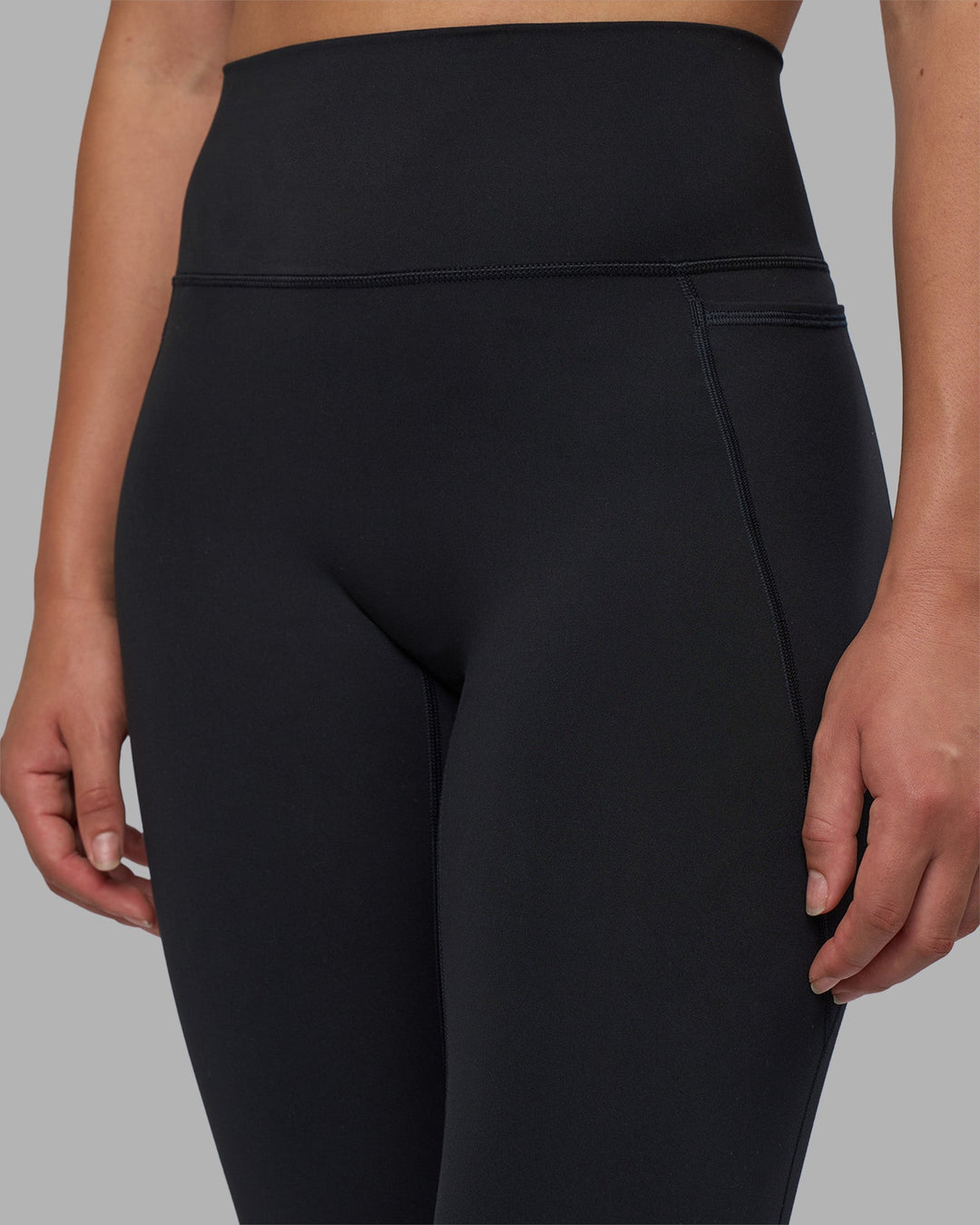 Woman wearing Fusion V-Contour Ultra High-Rise Full Length Legging Pockets - Black | Model:Charlize | Size:S