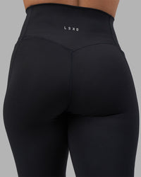 Woman wearing Fusion V-Contour Ultra High-Rise Full Length Legging Pockets - Black | Model:Charlize | Size:S