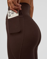 Woman wearing Fusion V-Contour Ultra High-Rise Full Length Legging Pockets - Hot Chocolate | Model:Amity | Size:S