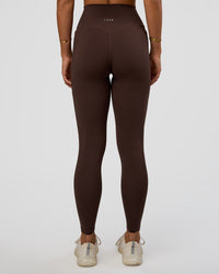 Woman wearing Fusion V-Contour Ultra High-Rise Full Length Legging Pockets - Hot Chocolate | Model:Amity | Size:S