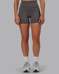 Woman wearing Fusion Ultra High-Rise 4" Short - Dark Storm | Set:true | Angle:front | Model:Hannah | Size:S