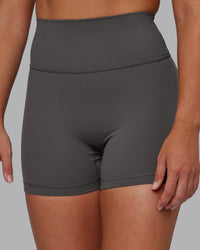 Woman wearing Fusion Ultra High-Rise 4" Short - Dark Storm | Set:true | Angle:closeup | Model:Hannah | Size:S