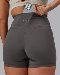 Woman wearing Fusion Ultra High-Rise 4" Short - Dark Storm | Model:Hannah | Size:S